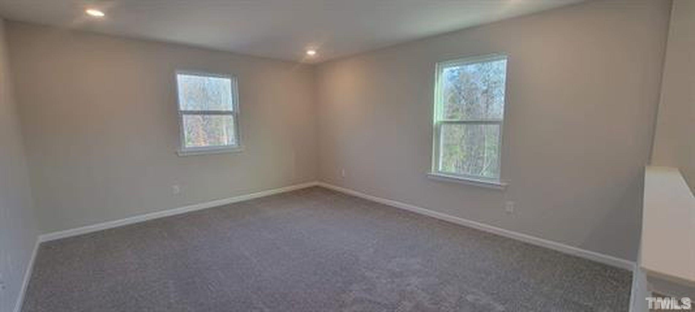 411 Rio Grande Lane Willow Spring, NC 27592 - Photo 12 of 29 an empty room with a window