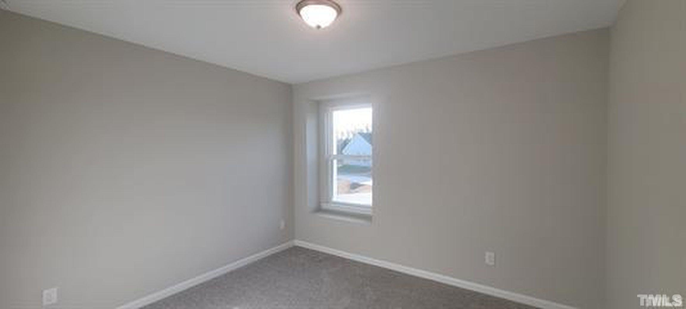 411 Rio Grande Lane Willow Spring, NC 27592 - Photo 16 of 29 a view of empty room with window