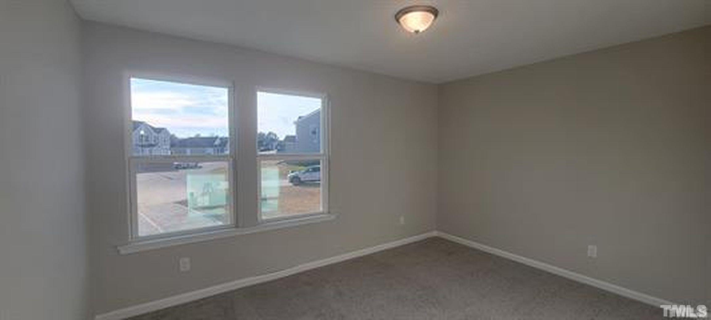 411 Rio Grande Lane Willow Spring, NC 27592 - Photo 19 of 29 an empty room with a window