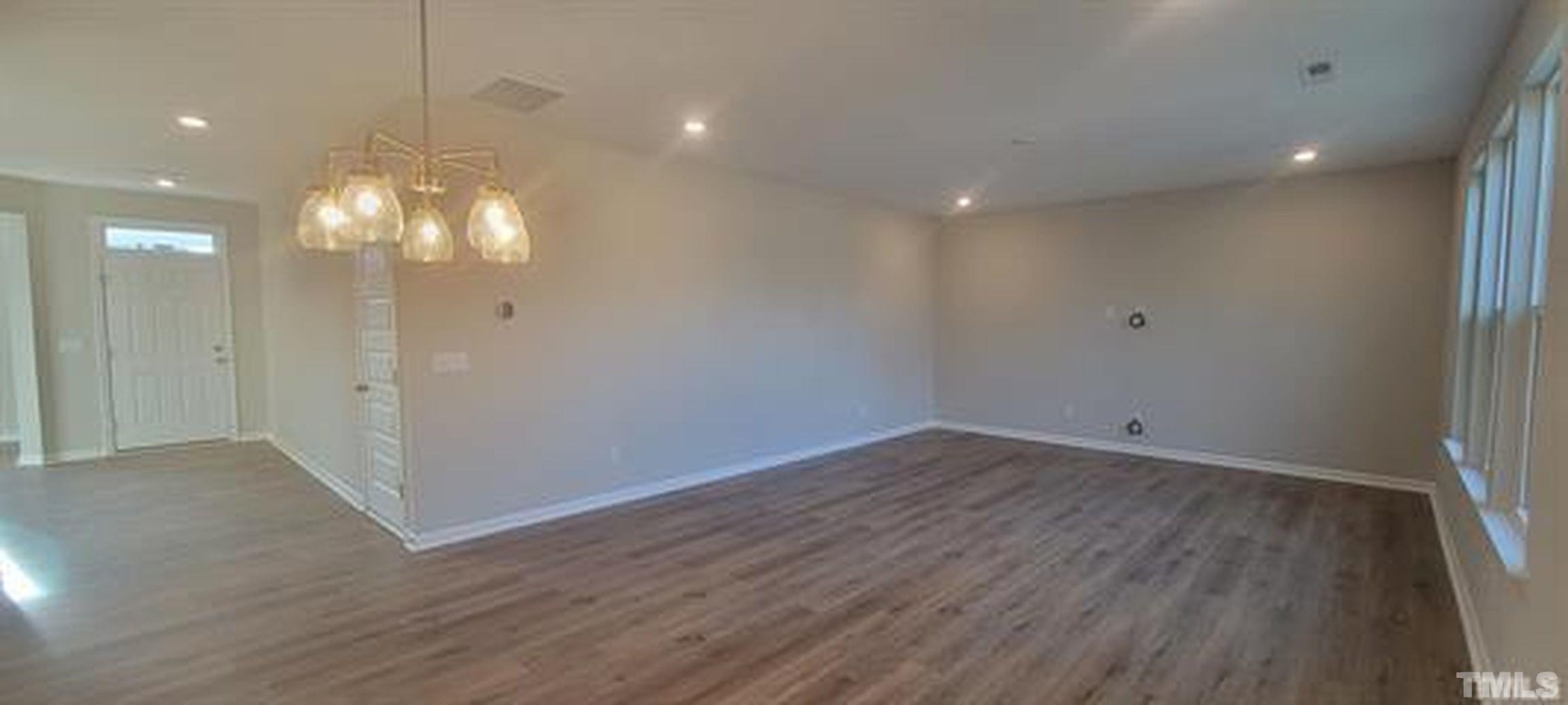 411 Rio Grande Lane Willow Spring, NC 27592 - Photo 7 of 29 a view of a room with wooden floor and window
