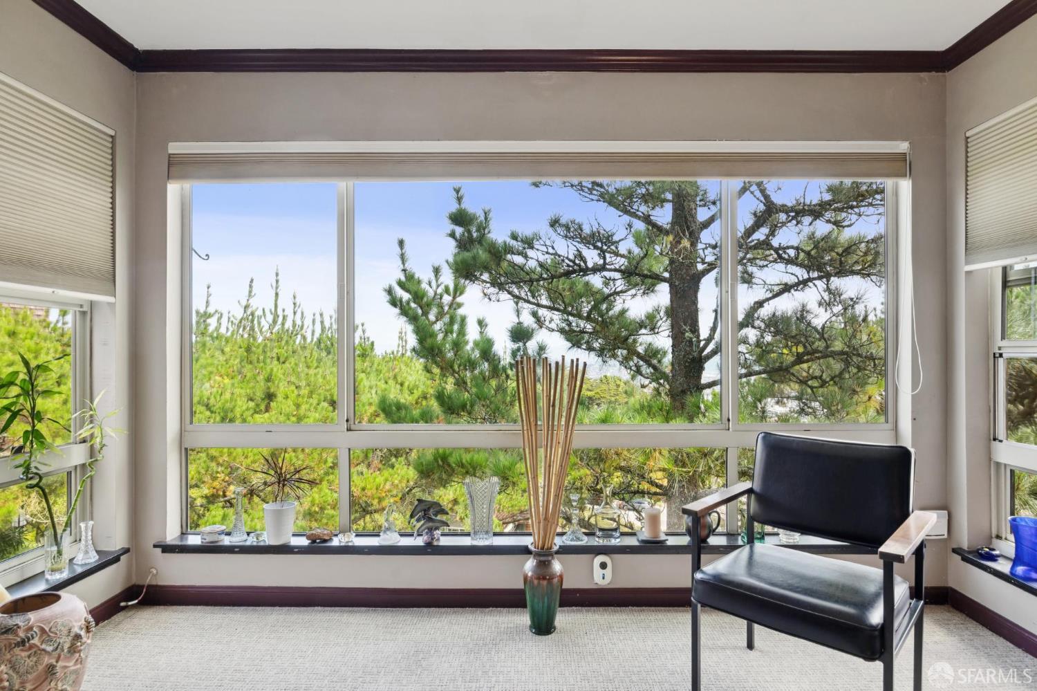 55 Red Rock Way, Unit 207 San Francisco, CA 94131 - Photo 1 of 15 a living room with furniture and a large window
