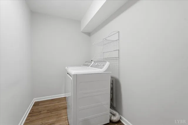 a bathroom with a tub a sink and mirror