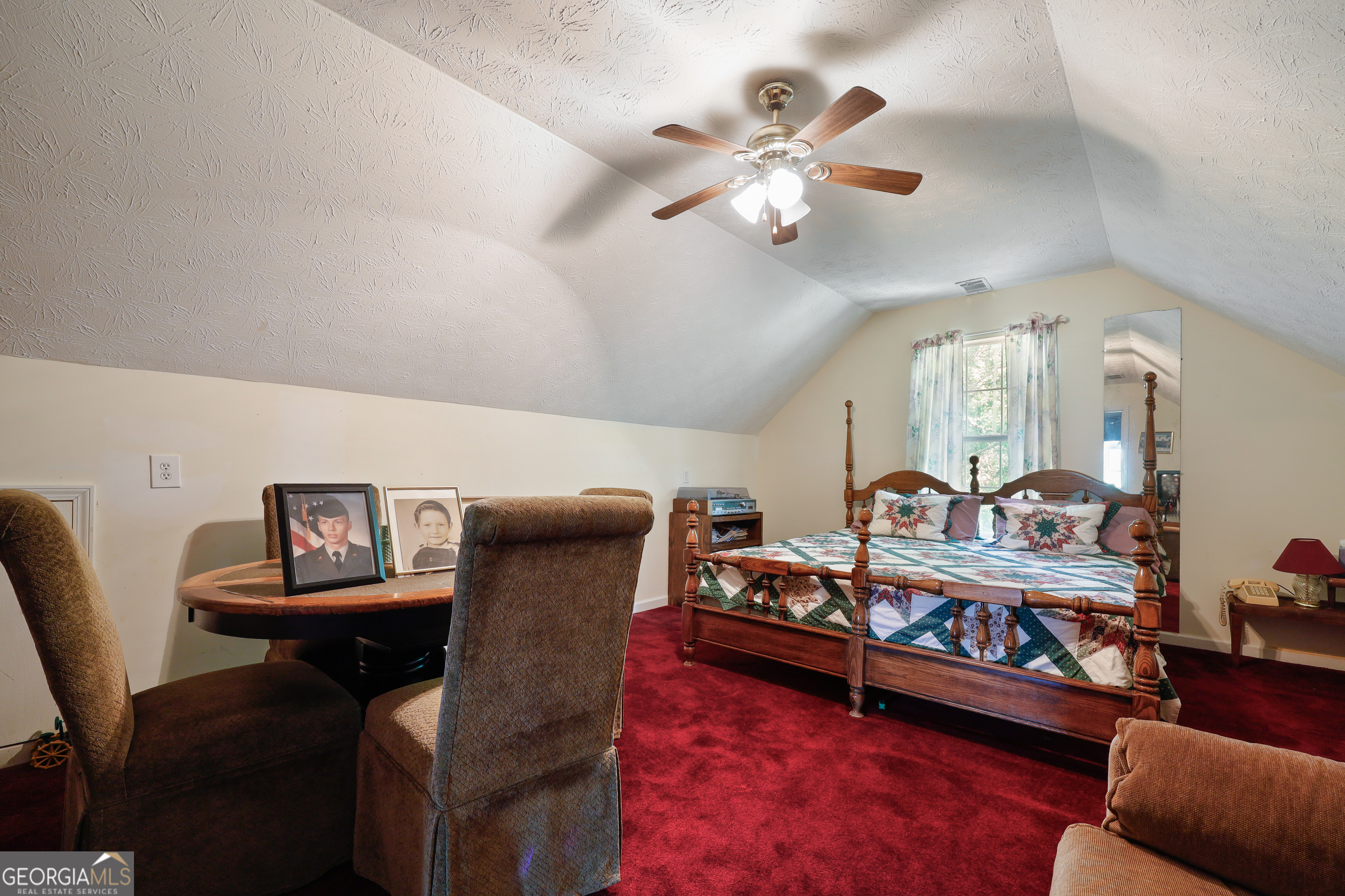 2433 Bear Creek Road Statham, GA 30666 - Photo 32 of 58 a view of a livingroom with furniture and a chandelier