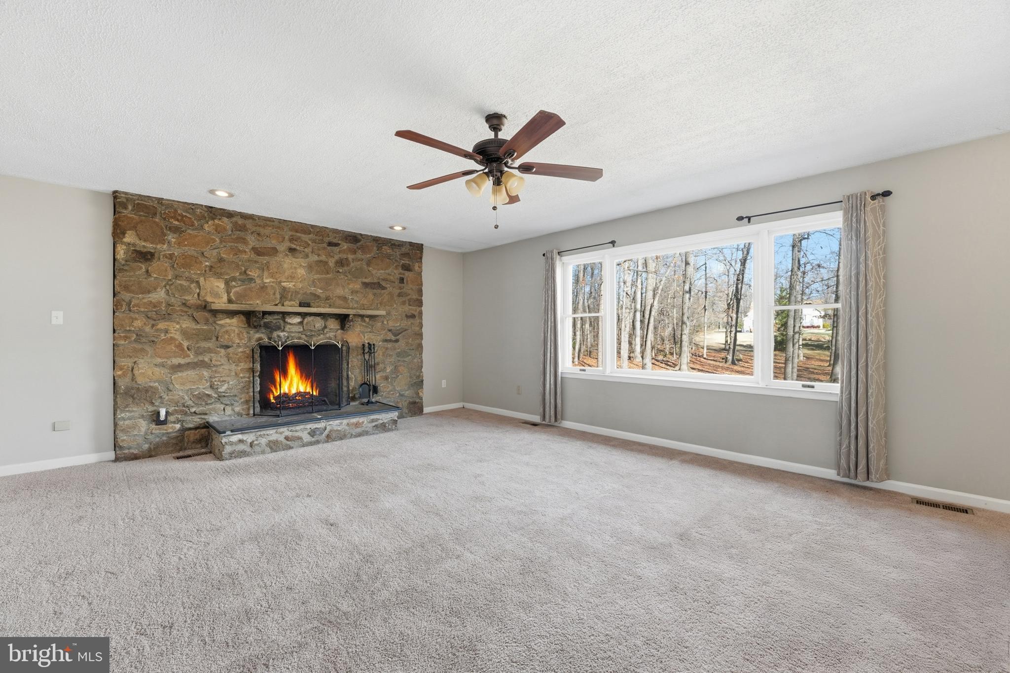 4431 Ringwood Road Nokesville, VA 20181 - Photo 11 of 14 a view of an empty room with window and fireplace