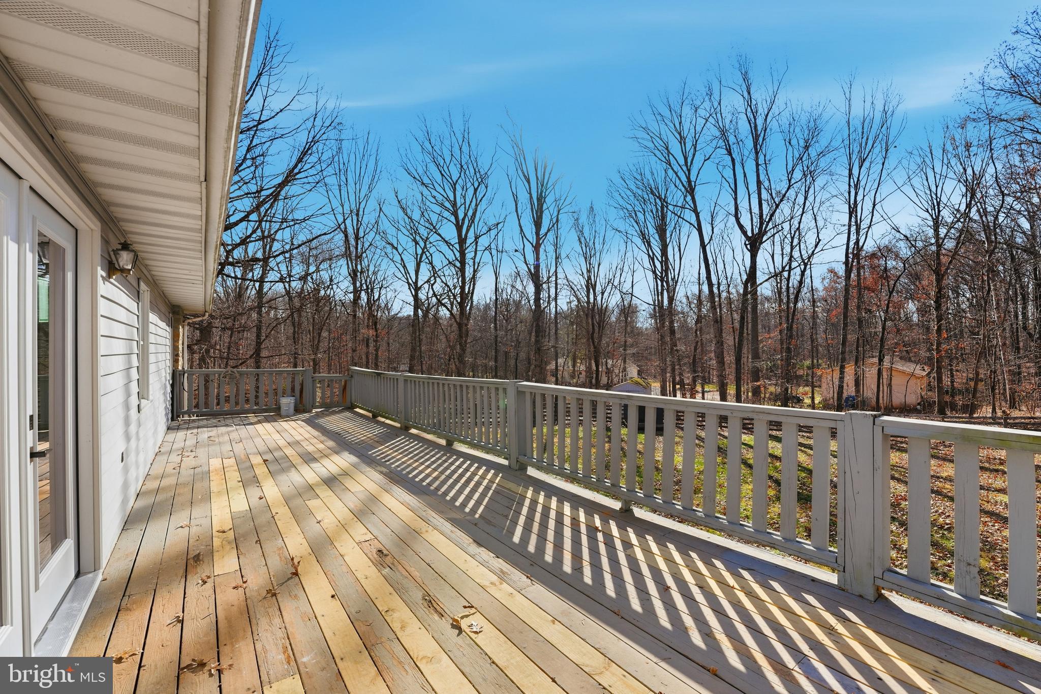 4431 Ringwood Road Nokesville, VA 20181 - Photo 4 of 14 a view of balcony with wooden floor and fence