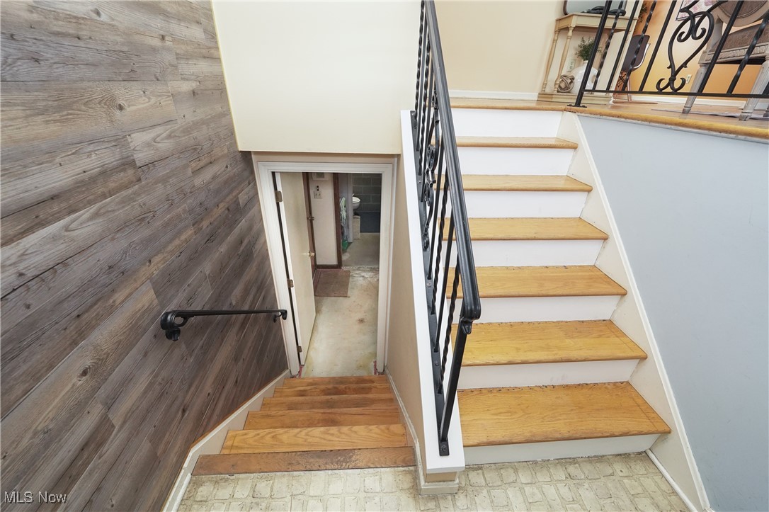 2674 Smith Road Fairlawn, OH 44333 - Photo 7 of 31 Stairway with wooden walls