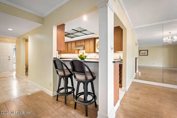 a dining room with furniture and window