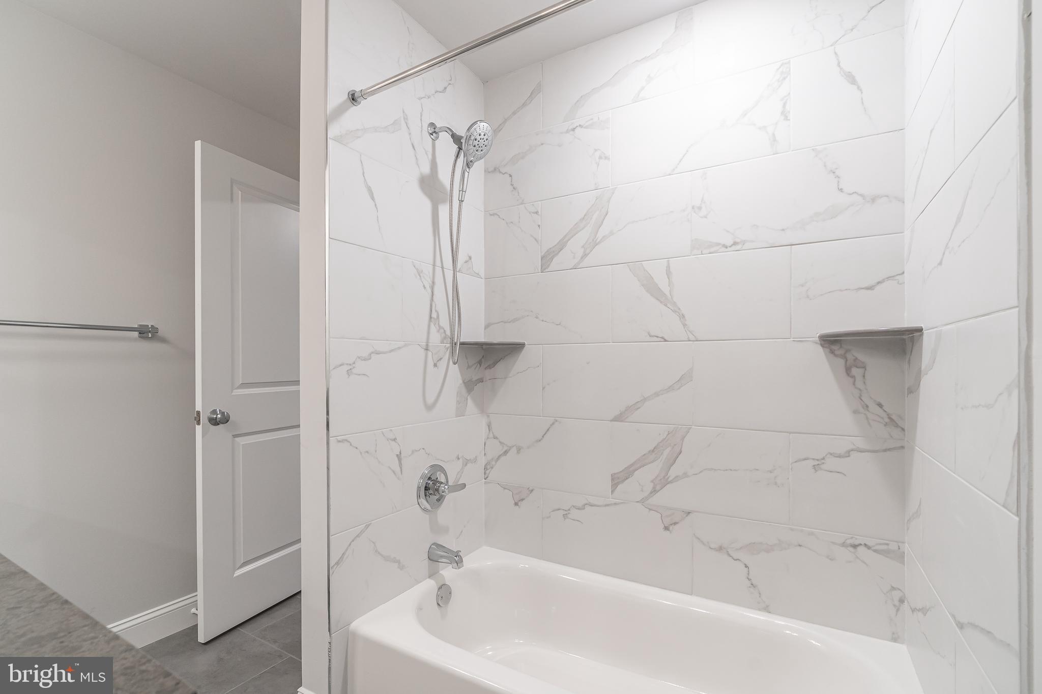 2202 Christian Street, Unit 1 Philadelphia, PA 19146 - Photo 12 of 27 a bathroom with a bathtub