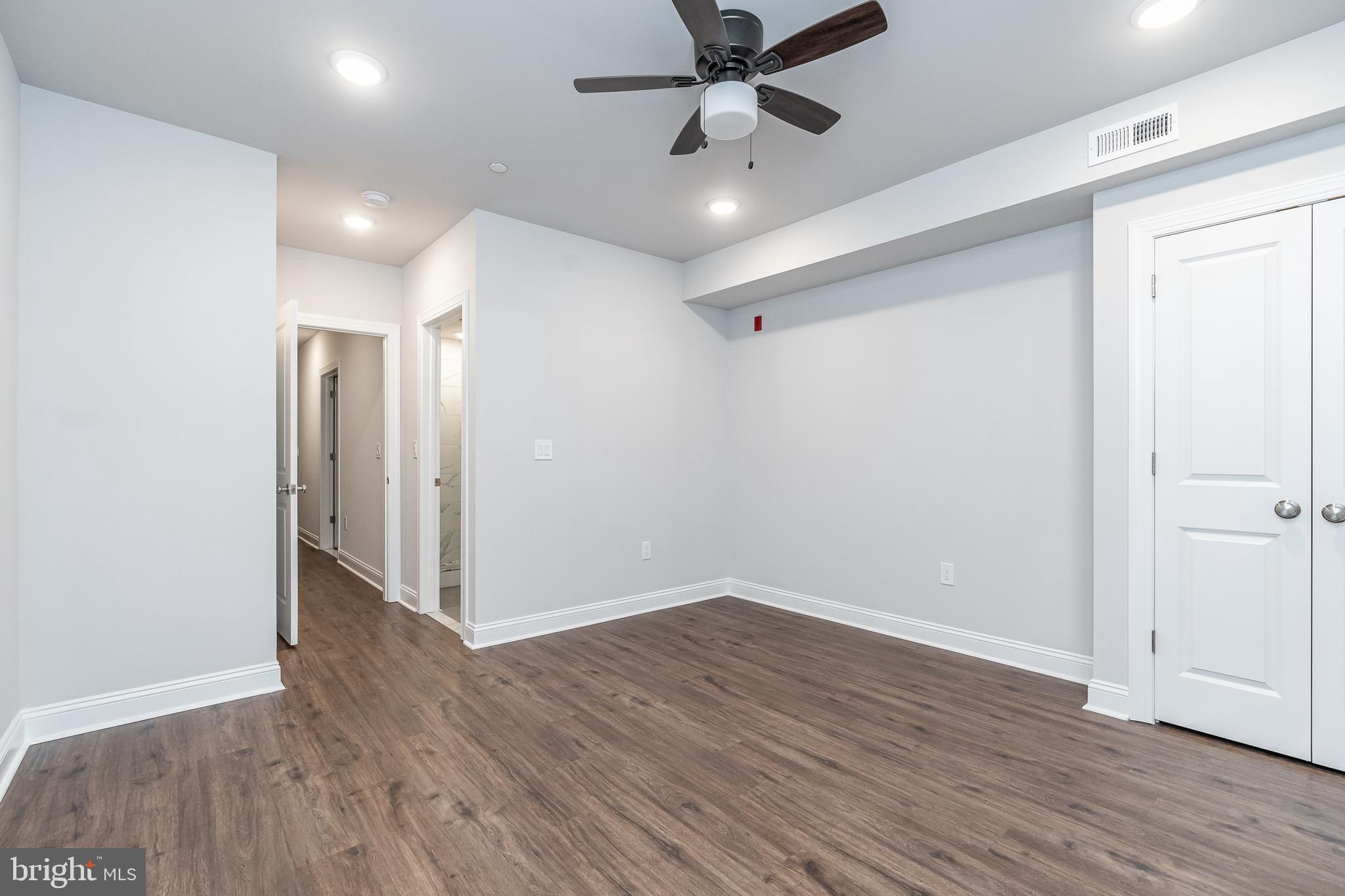 2202 Christian Street, Unit 1 Philadelphia, PA 19146 - Photo 20 of 27 a view of an empty room with wooden floor
