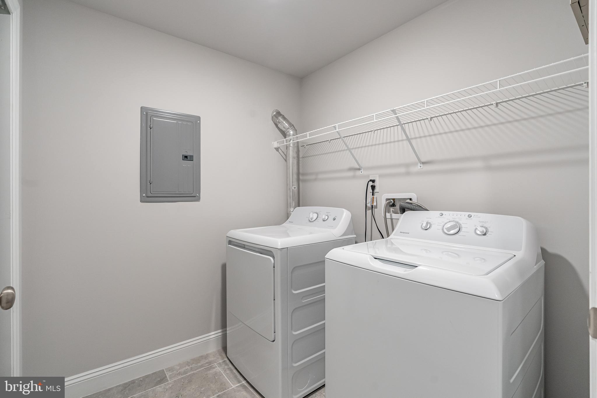 2202 Christian Street, Unit 1 Philadelphia, PA 19146 - Photo 22 of 27 a utility room with dryer and washer