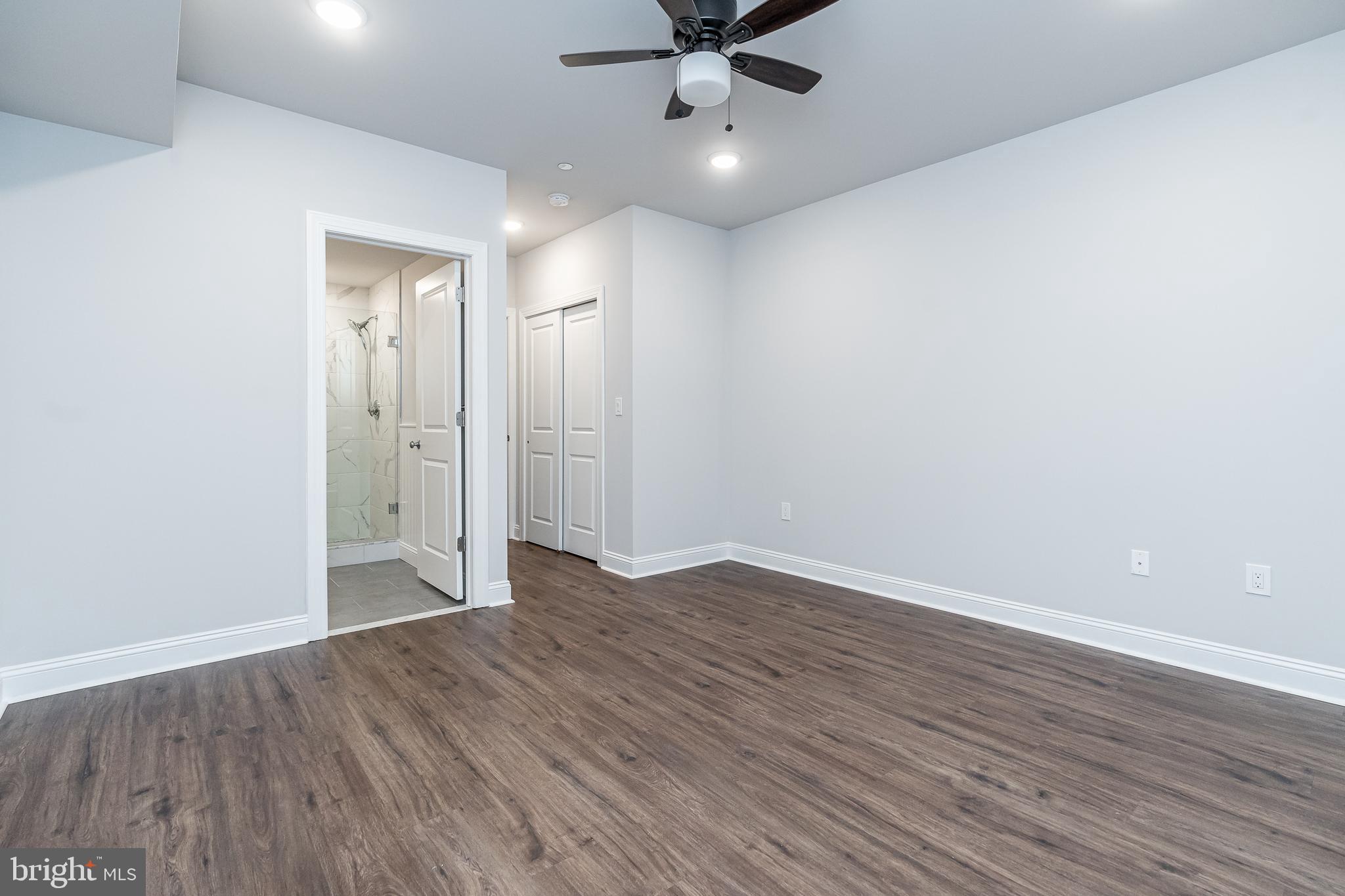 2202 Christian Street, Unit 1 Philadelphia, PA 19146 - Photo 26 of 27 a view of an empty room with wooden floor