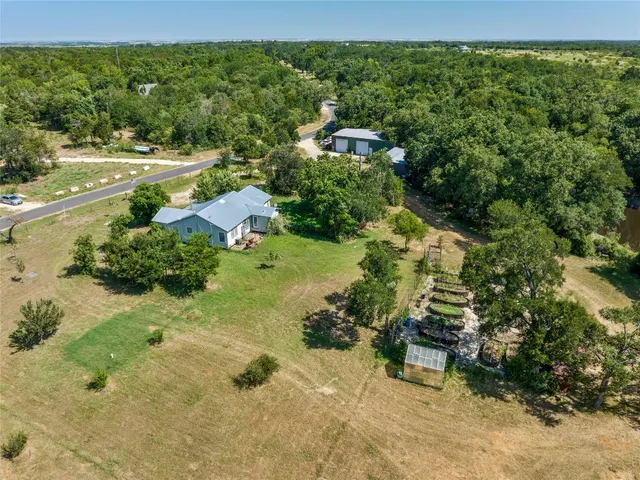 a view of a garden with an outdoor seating