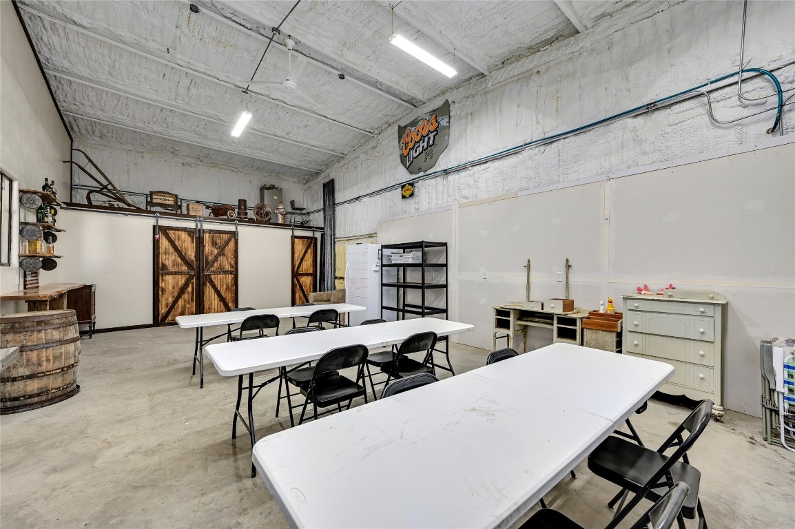 681 County Road 474 Elgin, TX 78621 - Photo 17 of 37 a room with furniture a rug and white walls