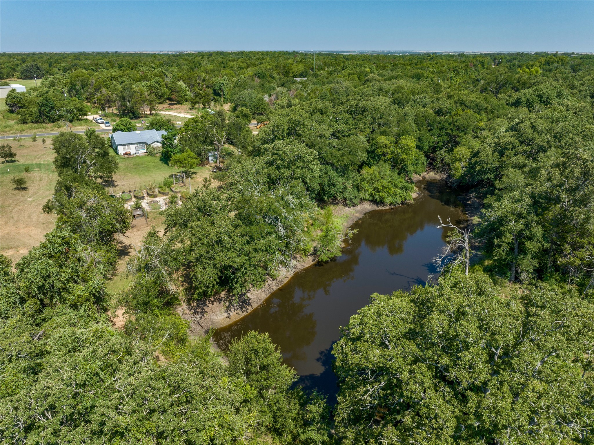 681 County Road 474 Elgin, TX 78621 - Photo 2 of 37 a view of a lake with houses
