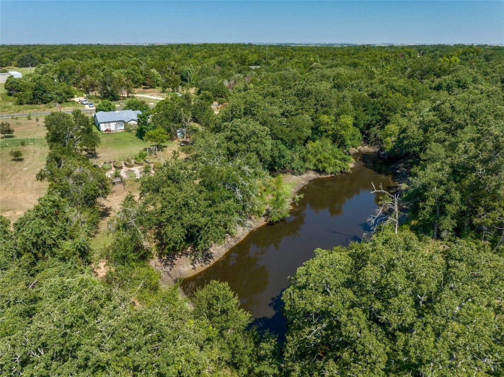 681 County Road 474 Elgin, TX 78621 - Photo 2 of 37 a view of a lake with houses