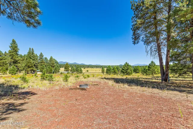 a view of lake with green space