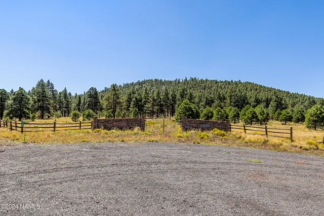 a view of a swimming pool with an outdoor seating and yard