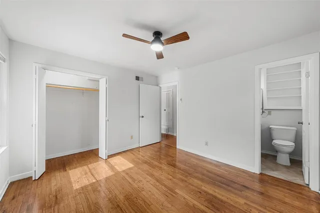 a bathroom with a toilet sink and shower