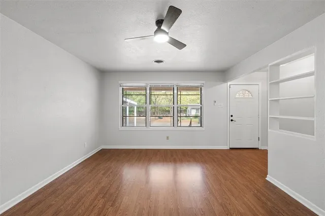 a open kitchen with cabinets and breakfast area