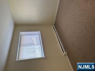 334 Grand Avenue, Unit 10 Leonia, NJ 07605 - Photo 9 of 10 a view of a room with window