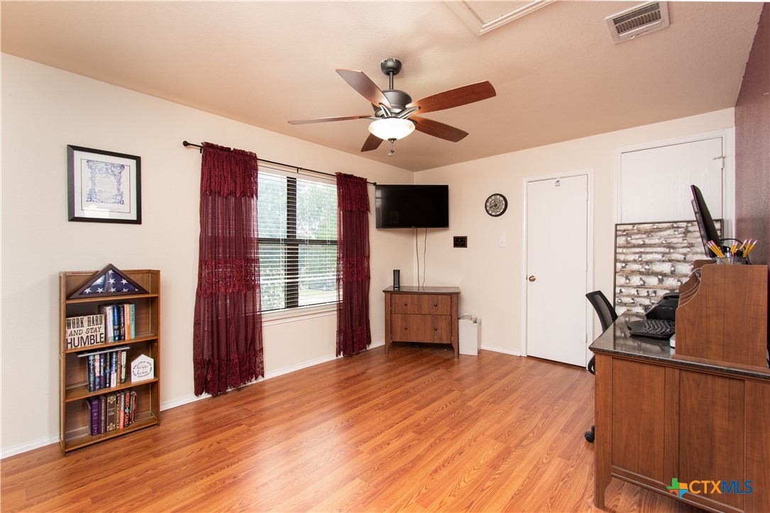 322 Fallen Leaf Lane Temple, TX 76502 - Photo 15 of 26 a view of workspace with wooden floor and windows