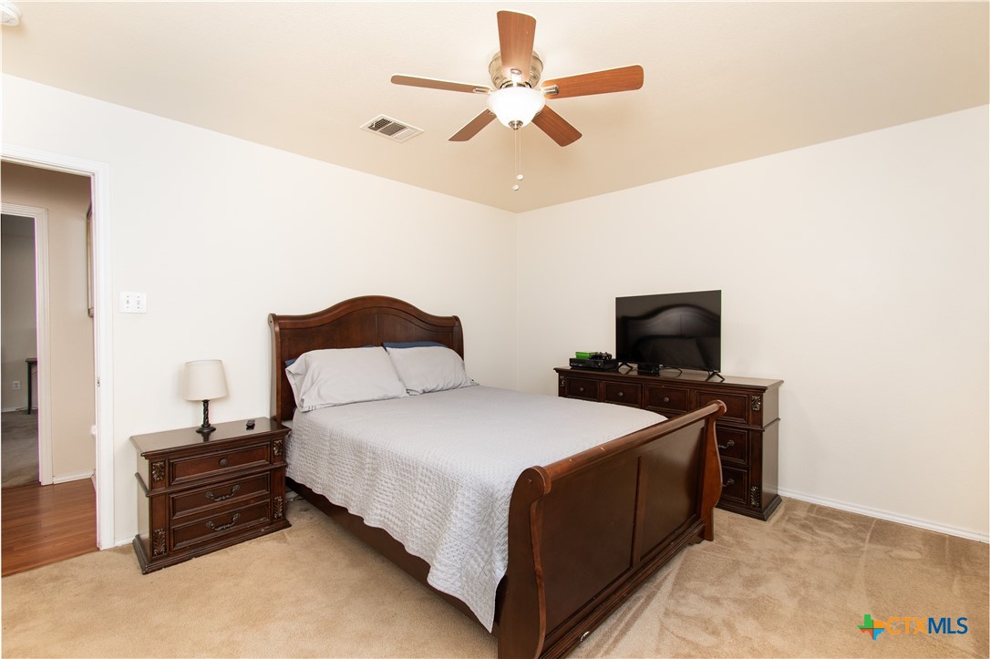 322 Fallen Leaf Lane Temple, TX 76502 - Photo 19 of 26 a bedroom with a bed and a tv