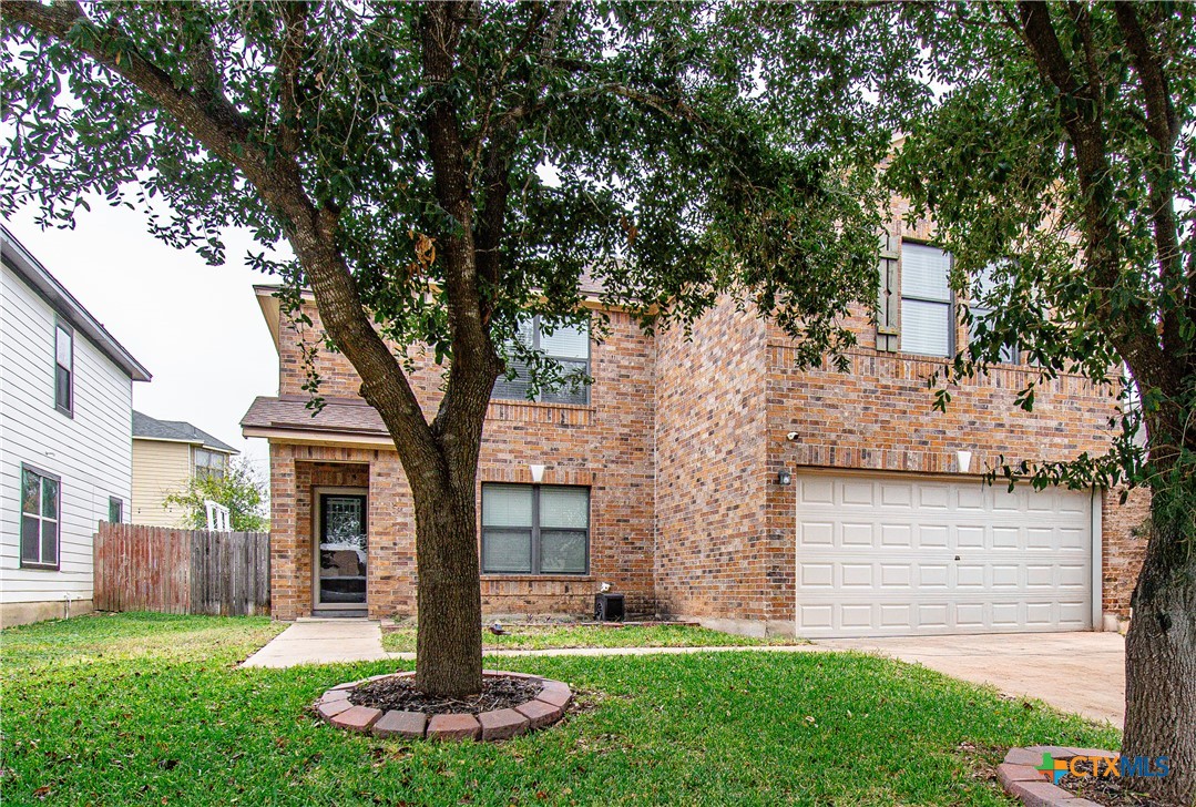 322 Fallen Leaf Lane Temple, TX 76502 - Photo 2 of 26 a front view of a house with a yard and large tree