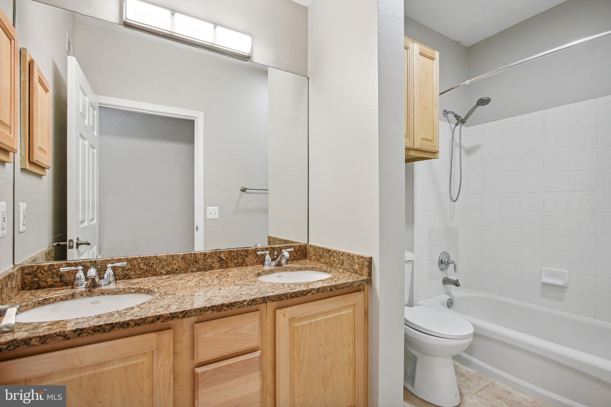 1530 Spring Gate Dr., Unit 9209 McLean, VA 22102 - Photo 19 of 41 Hallway bath with two sinks