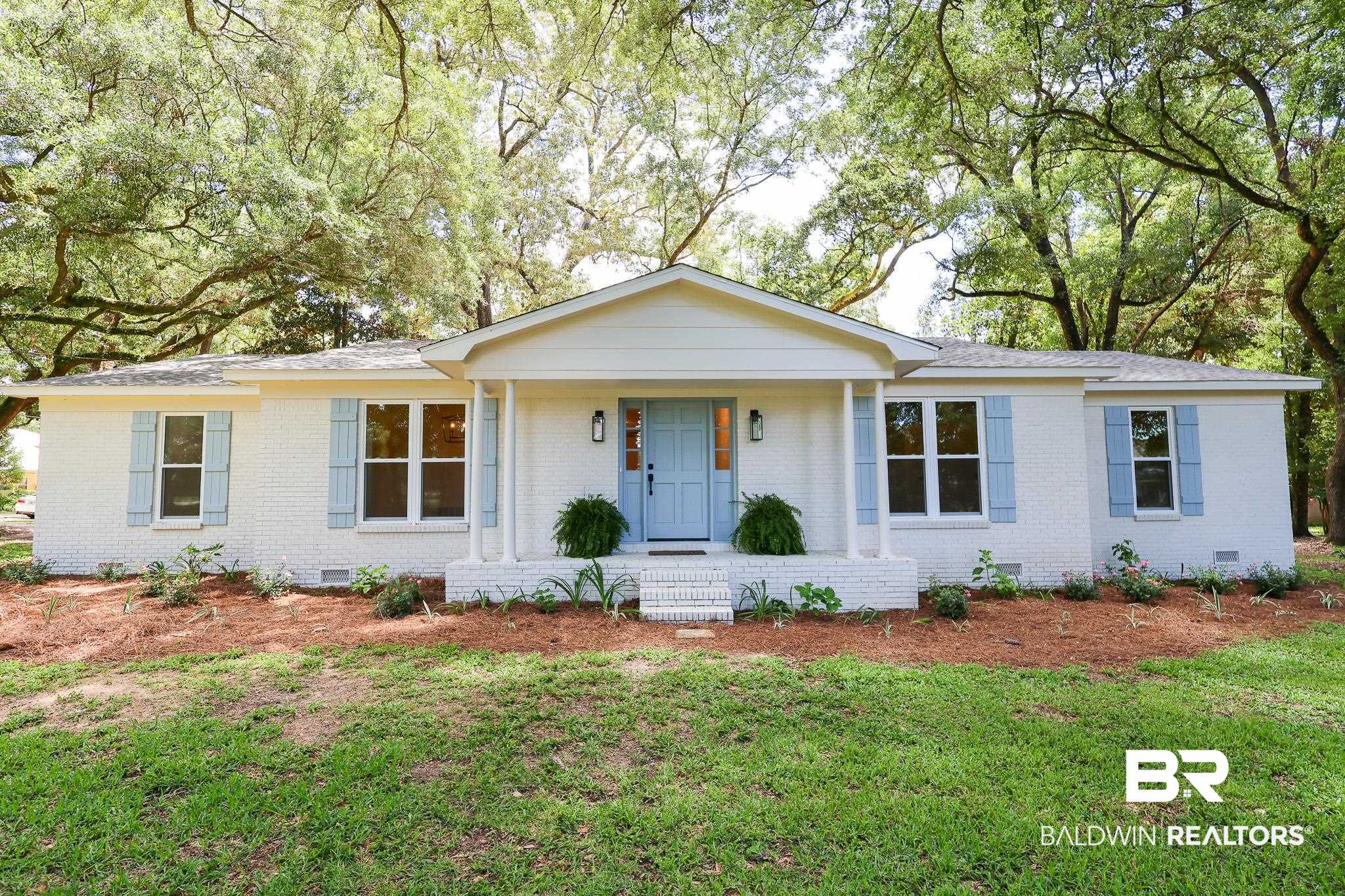 Ranch-style home with a front yard
