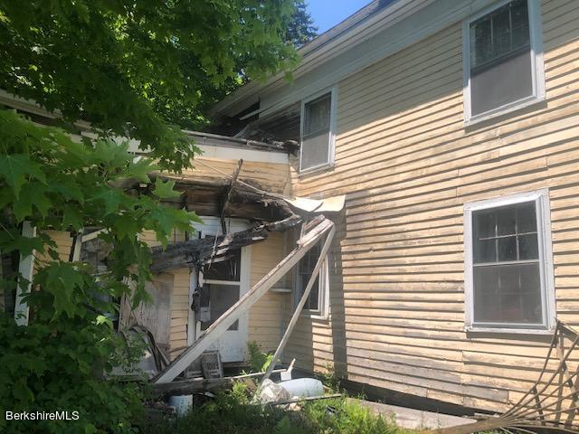 78 South Main Road Otis, MA 01253 - Photo 8 of 10 a view of a house with a small yard