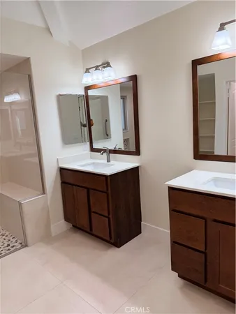 a room with a bed and a dresser