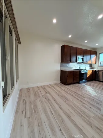 a room with wooden floor and furniture