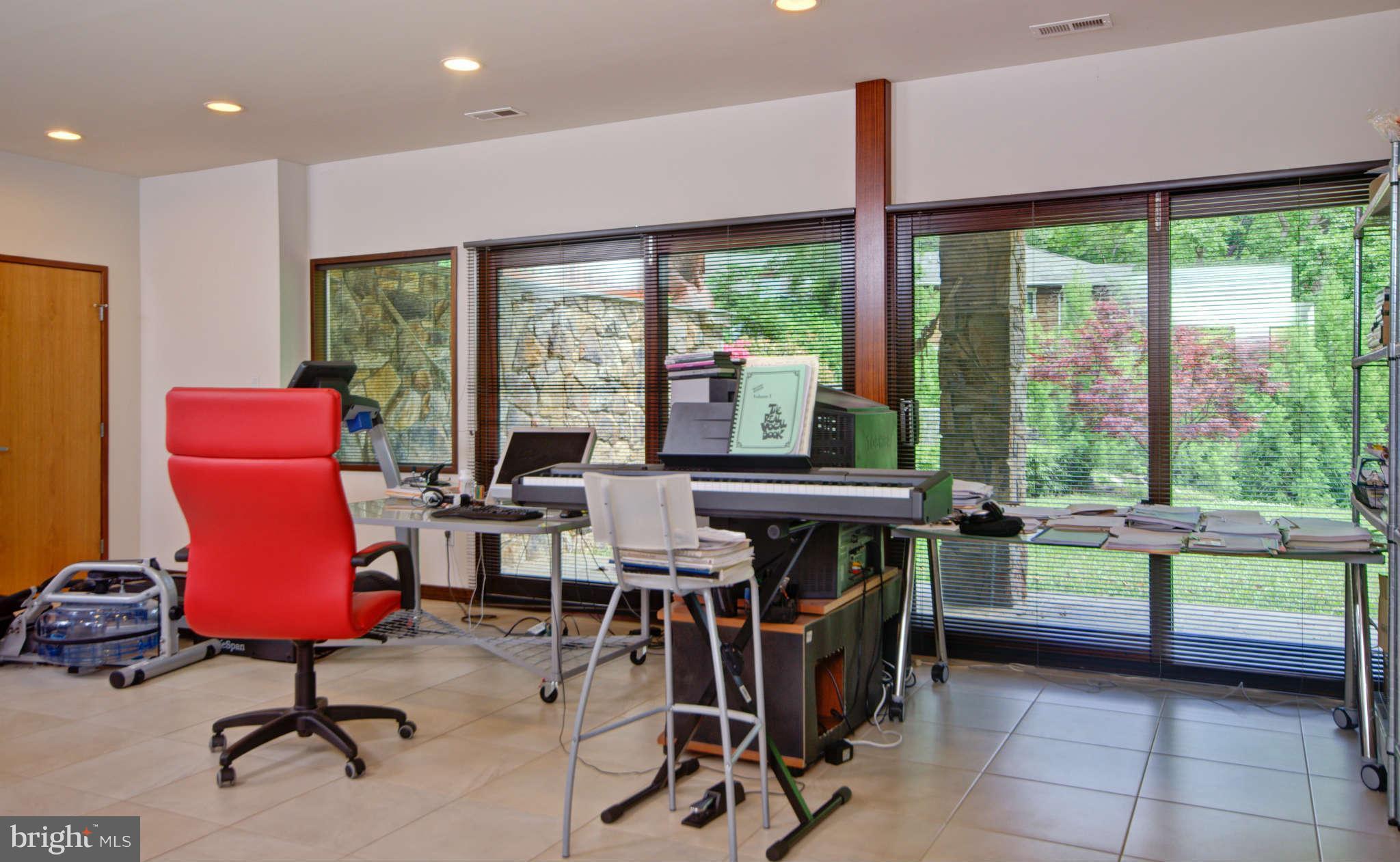 6525 76th Street Cabin John, MD 20818 - Photo 41 of 50 a view of a workspace with furniture and a window