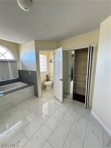 a kitchen with a stove a sink and a refrigerator