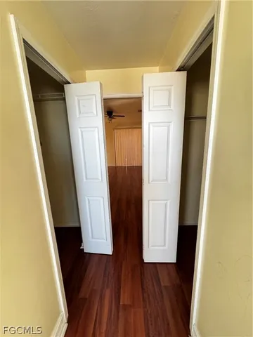 a large white kitchen with cabinets and a stove top oven