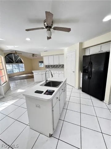 a view of a backyard with sitting area