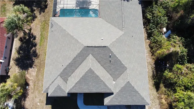 an aerial view of a house having yard