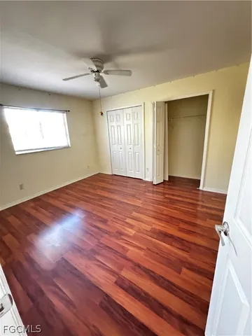 a view of an empty room and a window