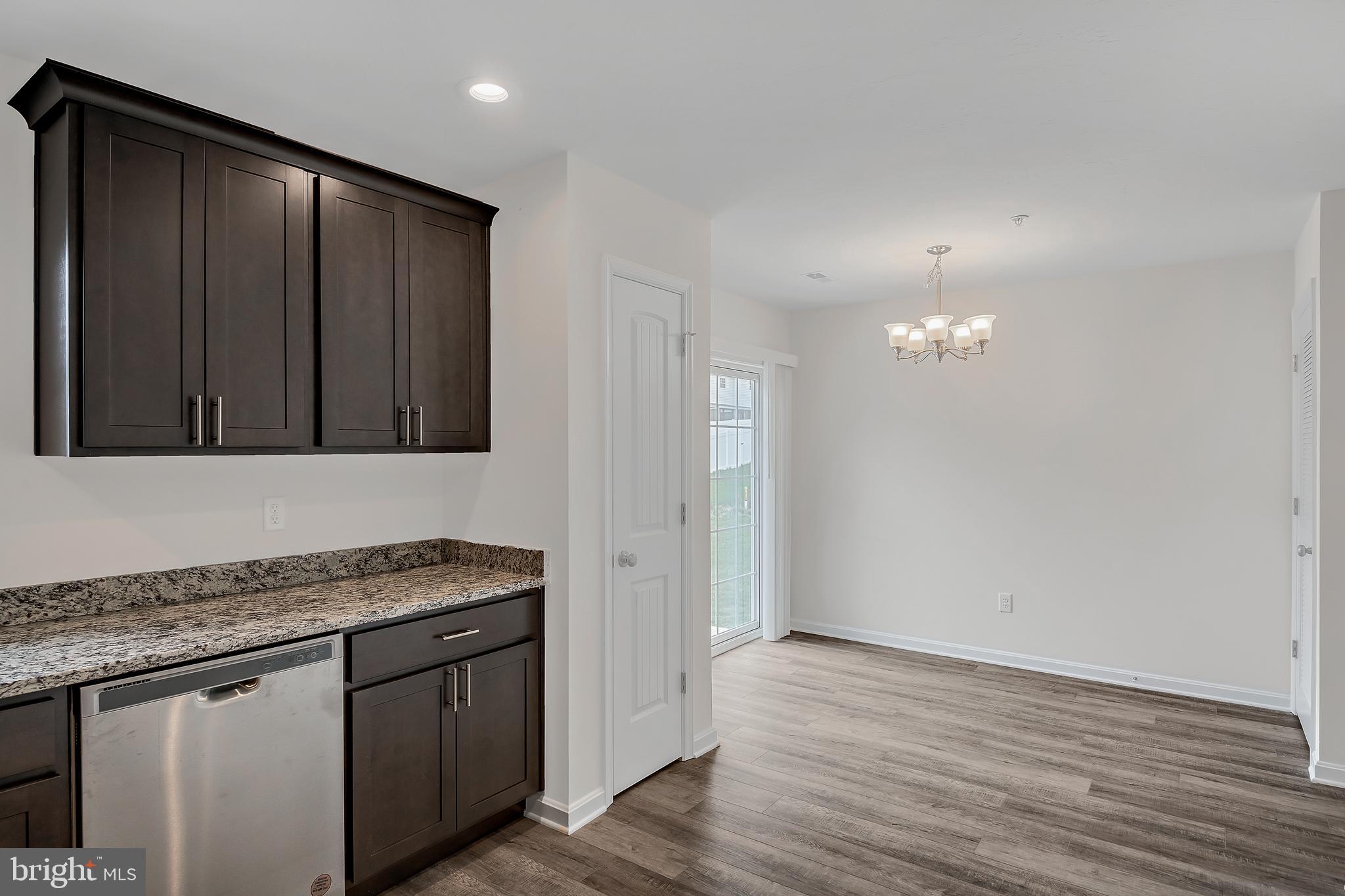 0 H Street, Unit 11 Carlisle, PA 17013 - Photo 7 of 19 a bathroom with a granite countertop sink and a mirror
