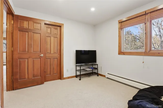 a view of a livingroom with furniture and a window
