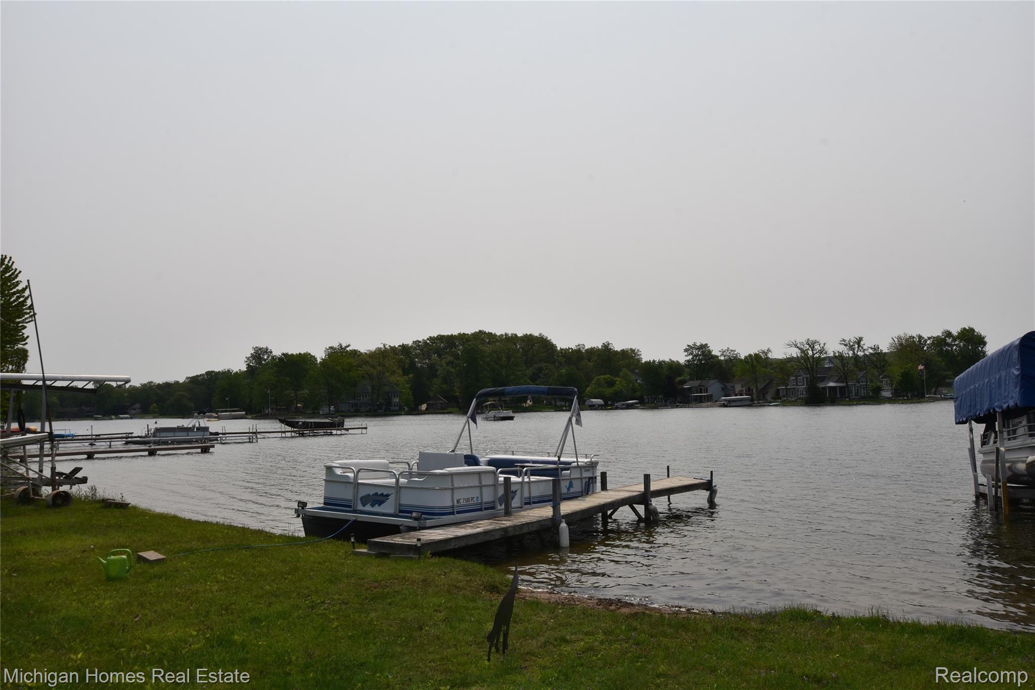 10466 Runyan Lake Road Fenton, MI 48430 - Photo 12 of 17 dock and sandy beach area