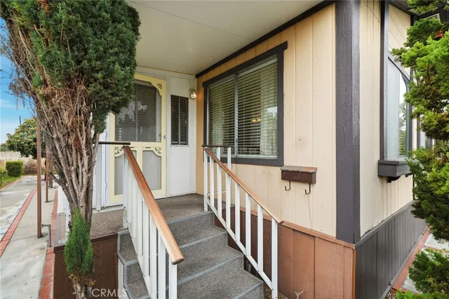 a view of a house with wooden stairs