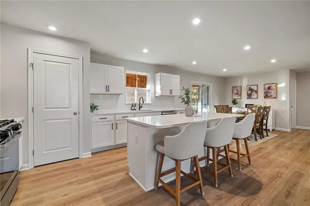 a kitchen with a table and chairs in it