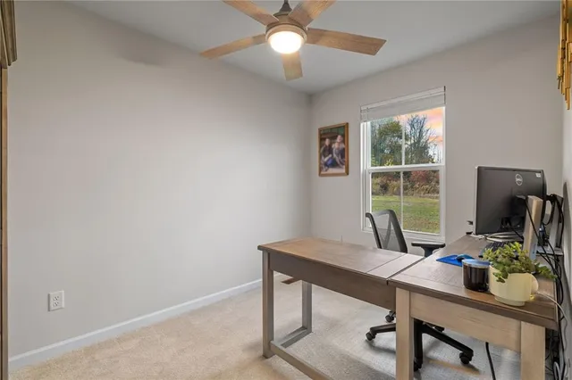 a view of a workspace with furniture