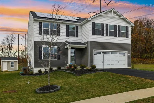 a front view of a house with a yard