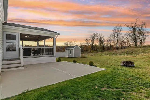 a view of a yard with an outdoor space