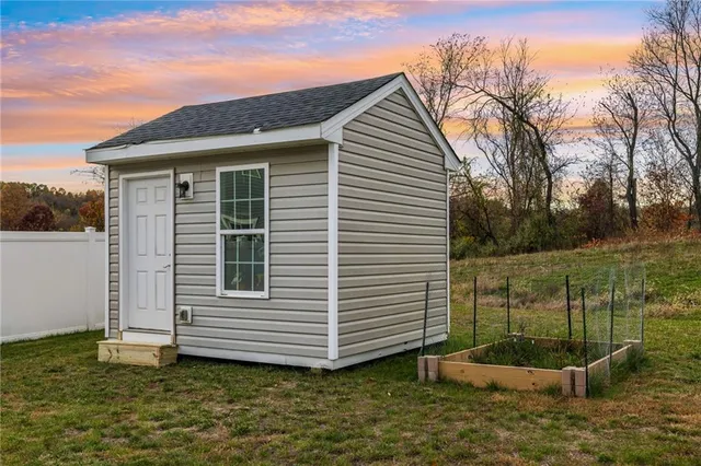 a front view of a house with a yard table and chairs