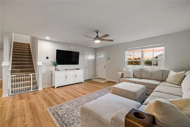 a living room with a flat screen tv and a window