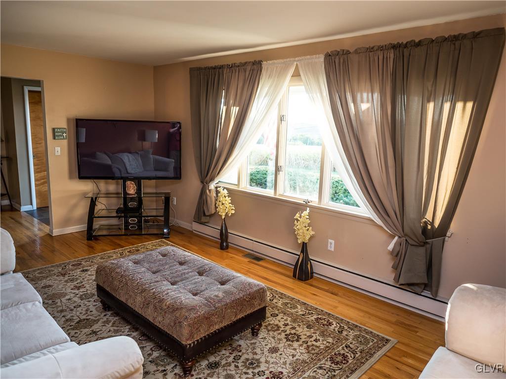 948 Engler Road Nazareth, PA 18064 - Photo 3 of 38 a living room with furniture and a flat screen tv