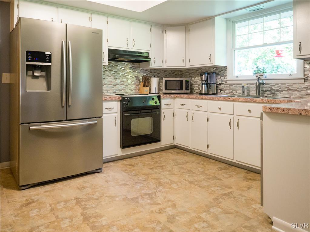 948 Engler Road Nazareth, PA 18064 - Photo 8 of 38 a kitchen with stainless steel appliances granite countertop a refrigerator sink and stove